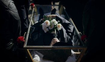 Movie still from “Anima Sound System - Dress Me In White” (2022), directed by Luka Kostil – Extreme Close Up shot, Overhead angle