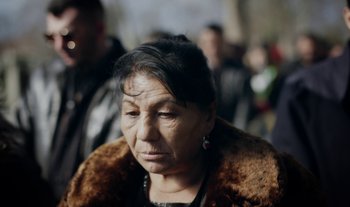 Movie still from “Anima Sound System - Dress Me In White” (2022), directed by Luka Kostil – Close Up shot, High angle