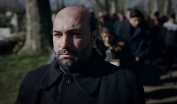 Movie still from “Anima Sound System - Dress Me In White” (2022), directed by Luka Kostil – Close Up shot, Low angle