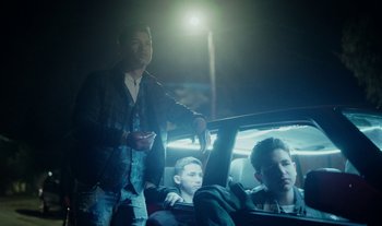 Movie still from “Anima Sound System - Dress Me In White” (2022), directed by Luka Kostil – Medium shot, Low angle