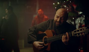 Movie still from “Anima Sound System - Dress Me In White” (2022), directed by Luka Kostil – Medium shot, Over the shoulder angle