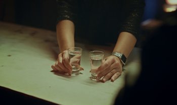 Movie still from “Anima Sound System - Dress Me In White” (2022), directed by Luka Kostil – Extreme Close Up shot, High angle