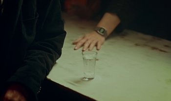 Movie still from “Anima Sound System - Dress Me In White” (2022), directed by Luka Kostil – Extreme Close Up shot, High angle