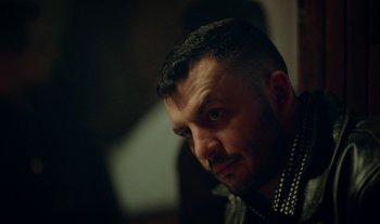 Movie still from “Anima Sound System - Dress Me In White” (2022), directed by Luka Kostil – Close Up shot, Low angle