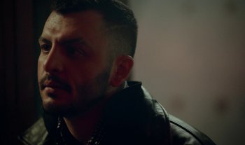 Movie still from “Anima Sound System - Dress Me In White” (2022), directed by Luka Kostil – Close Up shot, Low angle