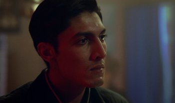 Movie still from “Anima Sound System - Dress Me In White” (2022), directed by Luka Kostil – Close Up shot, Low angle