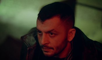 Movie still from “Anima Sound System - Dress Me In White” (2022), directed by Luka Kostil – Close Up shot, Low angle