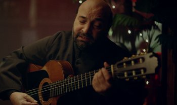 Movie still from “Anima Sound System - Dress Me In White” (2022), directed by Luka Kostil – Close Up shot, Over the shoulder angle