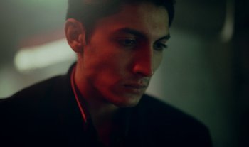 Movie still from “Anima Sound System - Dress Me In White” (2022), directed by Luka Kostil – Close Up shot, Low angle