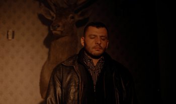 Movie still from “Anima Sound System - Dress Me In White” (2022), directed by Luka Kostil – Medium shot, High angle