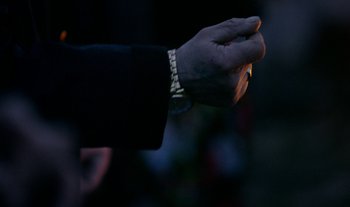 Movie still from “Anima Sound System - Dress Me In White” (2022), directed by Luka Kostil – Extreme Close Up shot, High angle