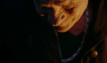 Movie still from “Anima Sound System - Dress Me In White” (2022), directed by Luka Kostil – Extreme Close Up shot, High angle