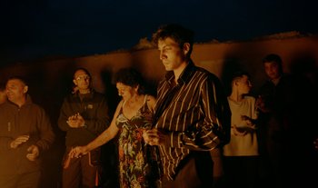 Movie still from “Anima Sound System - Dress Me In White” (2022), directed by Luka Kostil – Medium shot, High angle