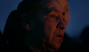 Movie still from “Anima Sound System - Dress Me In White” (2022), directed by Luka Kostil – Extreme Close Up shot, Over the shoulder angle