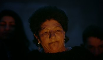 Movie still from “Anima Sound System - Dress Me In White” (2022), directed by Luka Kostil – Extreme Close Up shot, High angle