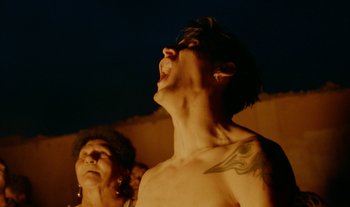 Movie still from “Anima Sound System - Dress Me In White” (2022), directed by Luka Kostil – Close Up shot, Low angle