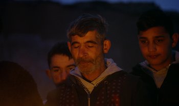 Movie still from “Anima Sound System - Dress Me In White” (2022), directed by Luka Kostil – Close Up shot, Over the shoulder angle