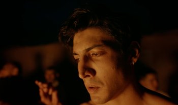 Movie still from “Anima Sound System - Dress Me In White” (2022), directed by Luka Kostil – Close Up shot, Low angle