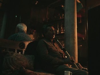 Movie still from “Marina Satti - Yiati Pouli M” (2022), directed by Alexis Gómez – Medium shot, Low angle