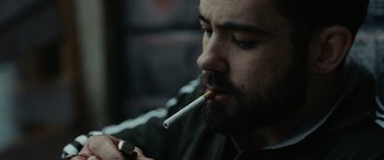 Movie still from “Chase & Status - When It Rains” (2022), directed by Hector Dockrill – Close Up shot, Over the shoulder angle