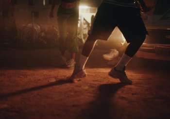 Movie still from “Nego Bala - Sonho” (2021), directed by Douglas Bernardt – Wide shot, Low angle