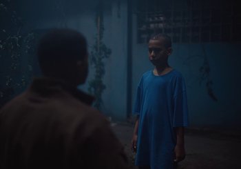 Movie still from “Nego Bala - Sonho” (2021), directed by Douglas Bernardt – Medium shot, Low angle