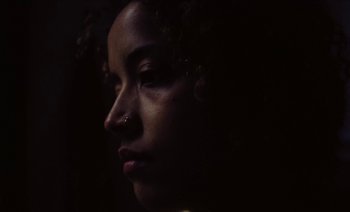 Movie still from “Jurdan Bryant - Enough” (2021), directed by Alonzo Hellerbach – Extreme Close Up shot, High angle