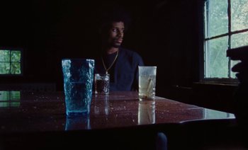 Movie still from “Jurdan Bryant - Enough” (2021), directed by Alonzo Hellerbach – Medium shot, Low angle