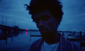 Movie still from “Jurdan Bryant - Enough” (2021), directed by Alonzo Hellerbach – Close Up shot, Low angle