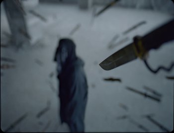 Movie still from “Ziak - Akimbo” (2021), directed by Bleu Désert – Extreme Close Up shot, Overhead angle