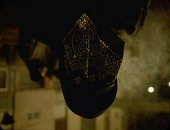 Movie still from “Ziak - Akimbo” (2021), directed by Bleu Désert – Close Up shot, Overhead angle