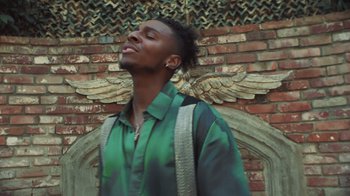 Movie still from “Masego - Mystery Lady” (2021), directed by Douglas Bernardt – Medium shot, Low angle