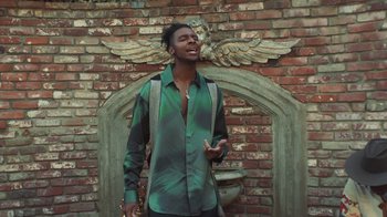 Movie still from “Masego - Mystery Lady” (2021), directed by Douglas Bernardt – Medium shot, Low angle