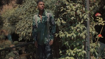 Movie still from “Masego - Mystery Lady” (2021), directed by Douglas Bernardt – Medium shot, Low angle