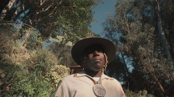 Movie still from “Masego - Mystery Lady” (2021), directed by Douglas Bernardt – Close Up shot, Low angle