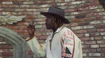Movie still from “Masego - Mystery Lady” (2021), directed by Douglas Bernardt – Medium shot, Low angle