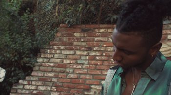 Movie still from “Masego - Mystery Lady” (2021), directed by Douglas Bernardt – Close Up shot, Low angle