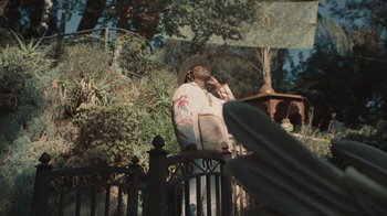 Movie still from “Masego - Mystery Lady” (2021), directed by Douglas Bernardt – Medium shot, Low angle