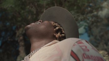 Movie still from “Masego - Mystery Lady” (2021), directed by Douglas Bernardt – Close Up shot, Low angle