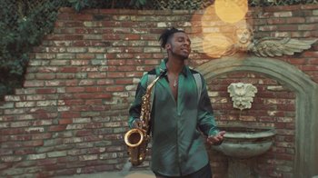 Movie still from “Masego - Mystery Lady” (2021), directed by Douglas Bernardt – Medium shot, Low angle
