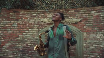 Movie still from “Masego - Mystery Lady” (2021), directed by Douglas Bernardt – Medium shot, Low angle