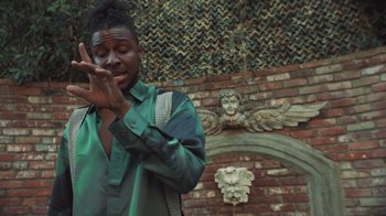 Movie still from “Masego - Mystery Lady” (2021), directed by Douglas Bernardt – Medium shot, Low angle