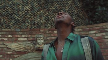 Movie still from “Masego - Mystery Lady” (2021), directed by Douglas Bernardt – Close Up shot, Low angle