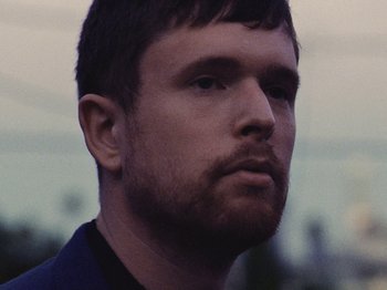 Movie still from “James Blake - Say What You Will” (2021), directed by Bear Damen – Close Up shot, Low angle