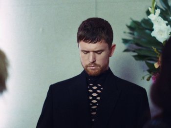 Movie still from “James Blake - Say What You Will” (2021), directed by Bear Damen – Close Up shot, Low angle