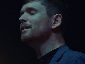Movie still from “James Blake - Say What You Will” (2021), directed by Bear Damen – Close Up shot, Low angle