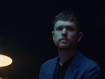 Movie still from “James Blake - Say What You Will” (2021), directed by Bear Damen – Close Up shot, Low angle