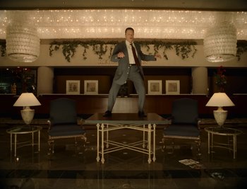 Movie still from “Fatboy Slim - Weapon Of Choice” (2021), directed by Spike Jonze – Wide shot, Low angle