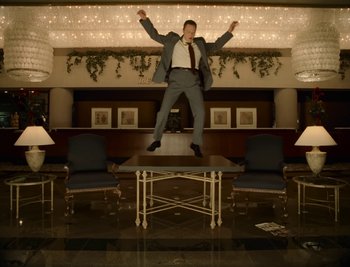 Movie still from “Fatboy Slim - Weapon Of Choice” (2021), directed by Spike Jonze – Wide shot, Low angle