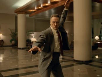 Movie still from “Fatboy Slim - Weapon Of Choice” (2021), directed by Spike Jonze – Medium shot, Low angle